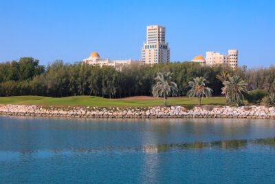 Lake with buildings in background