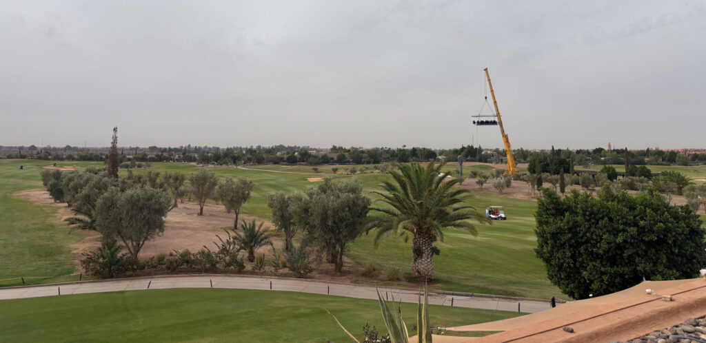View overlooking Al Maaden Golf Course with palm trees in the foreground
