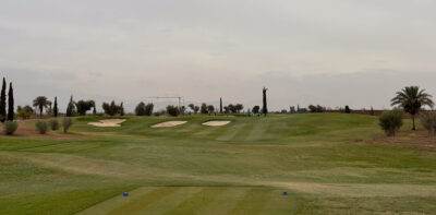 Tee box overlooking fairway with three bunkers at Al Maaden Golf Course