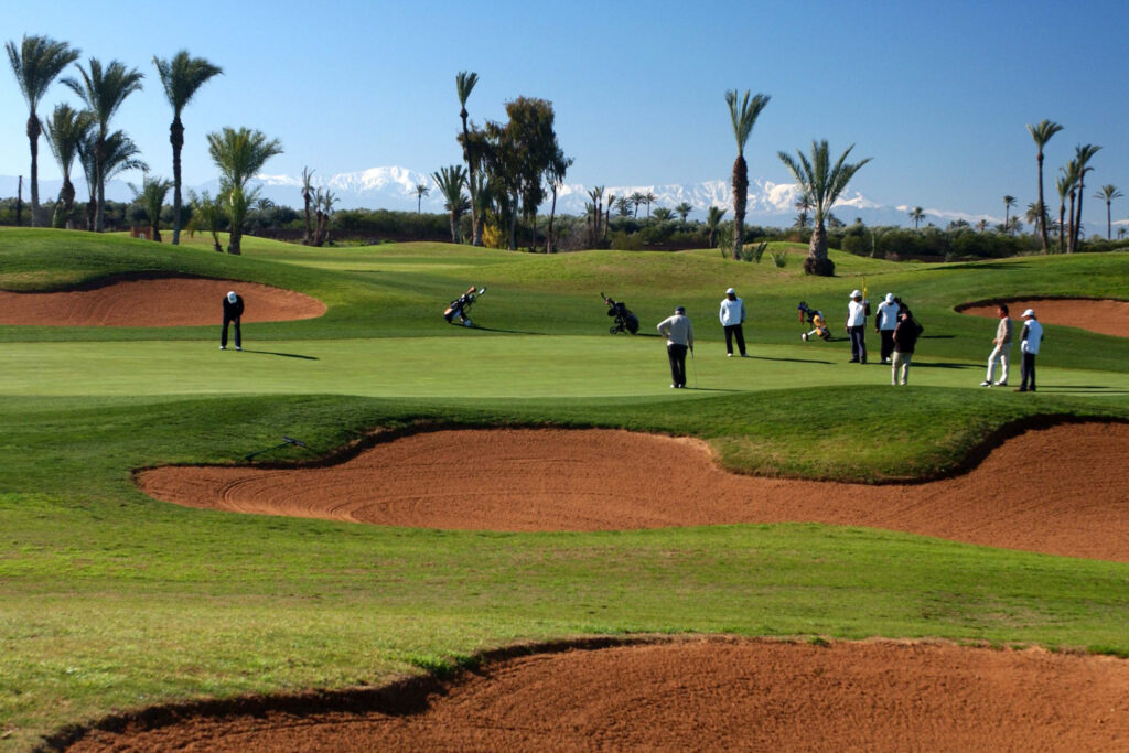 Green with surrounding bunkers at Amelkis Golf Course