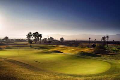 Green with landsape in the background at Amelkis Golf Course
