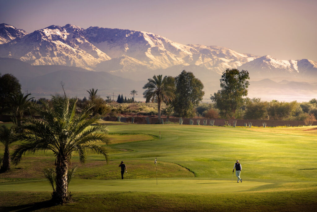 Green with mountains in the background at Amelkis Golf Course