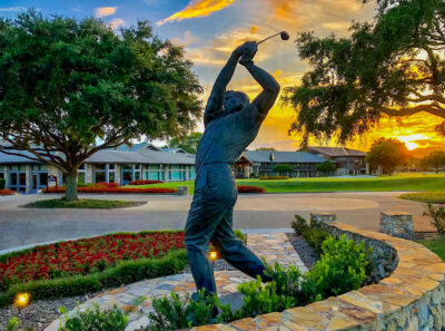 Statue of Arnold Palmer at the Bay Hill Club at sunset