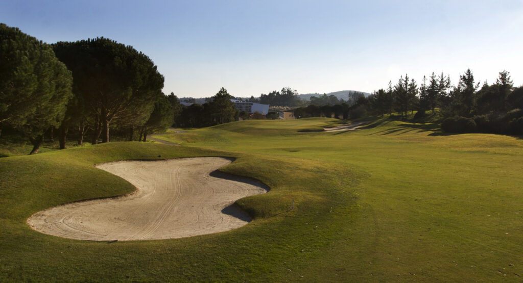 Bunker on the fairway with trees around at Belas Clube de Campo Golf Course