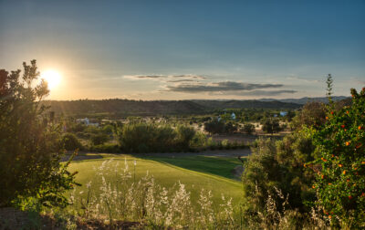 Look at the fairway through trees at Benamor golf course