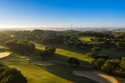 Aerial view of fairway with bunkers and trees around
