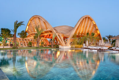 The swimming pool with the magnificent lit up pool bar during the evening