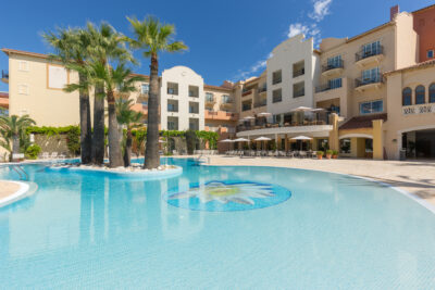 Outdoor pool and exterior of hotel at Denia La Sella Golf Resort & Spa