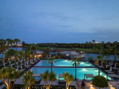 Domes Lakes Algarve outdoor pools lit up at night