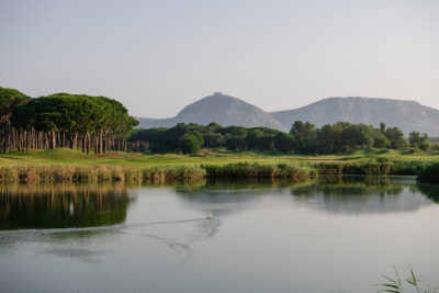 Lake with fairway and trees in background at Emporda - Links Course