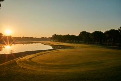 Hole at sunset with trees