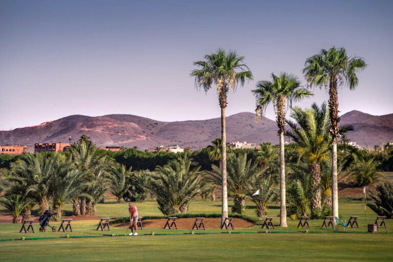Drivign range with mountains in background at Golf Club Palmeraie