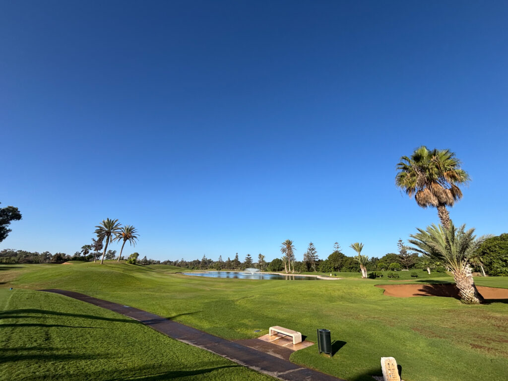 Course view with pathway and lakes at Golf du Soleil