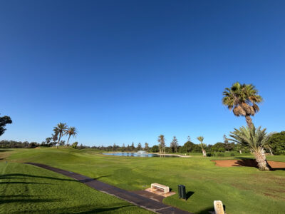 Course view with pathway and lakes at Golf du Soleil