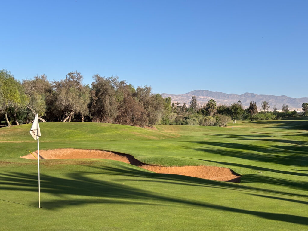 Greenside with views of landscape in background at Golf du Soleil