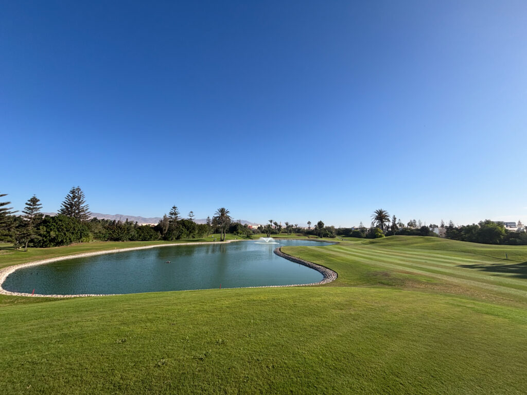 Fairway with lake running alongside at Golf du Soleil