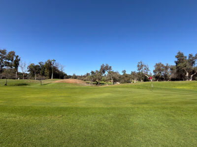 View of sloping green looking back towards the fairway