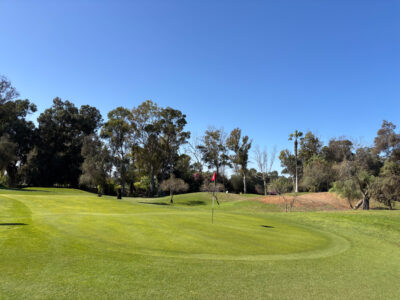 Back of the green looking down the sloping green at Golf Les Dunes Course