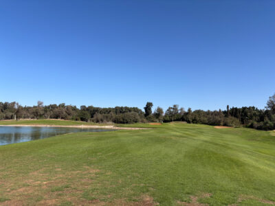 Fairway with lake on the left side at Golf Les Dunes Course