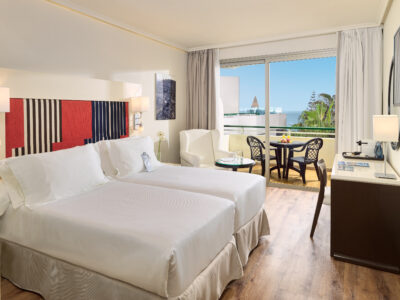 H10 Las Palmeras Hotel bedroom with patio doors