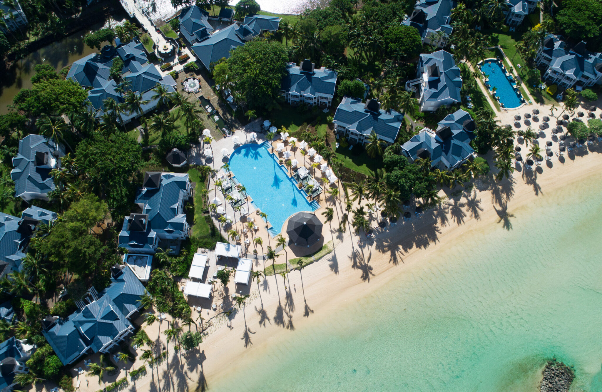 Aerial view of the beach and outdoor pool at Heritage Le Telfair