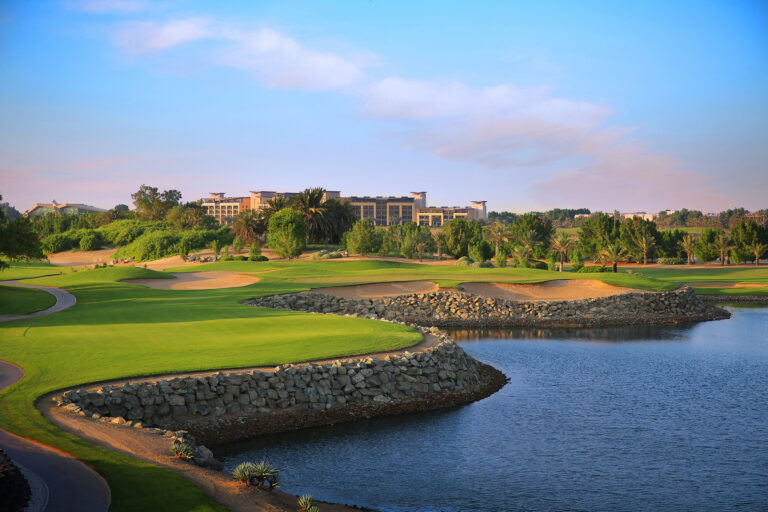 Fairway with bunkers and lake at Abu Dhabi Golf Club