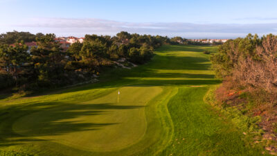 Golf hole with trees around