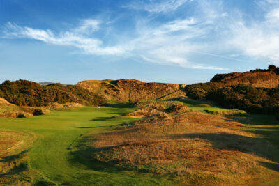 Hole at Championship Links at Royal County Down with mounds around