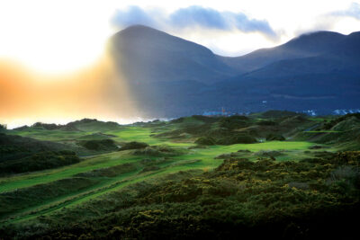Aerial view of fairway with hills in background at Championship Links at Royal County Down