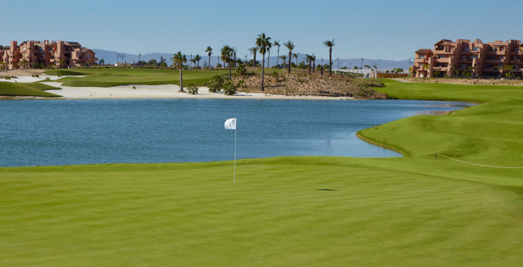 A hole with a lake in background at Mar Menor Golf Course