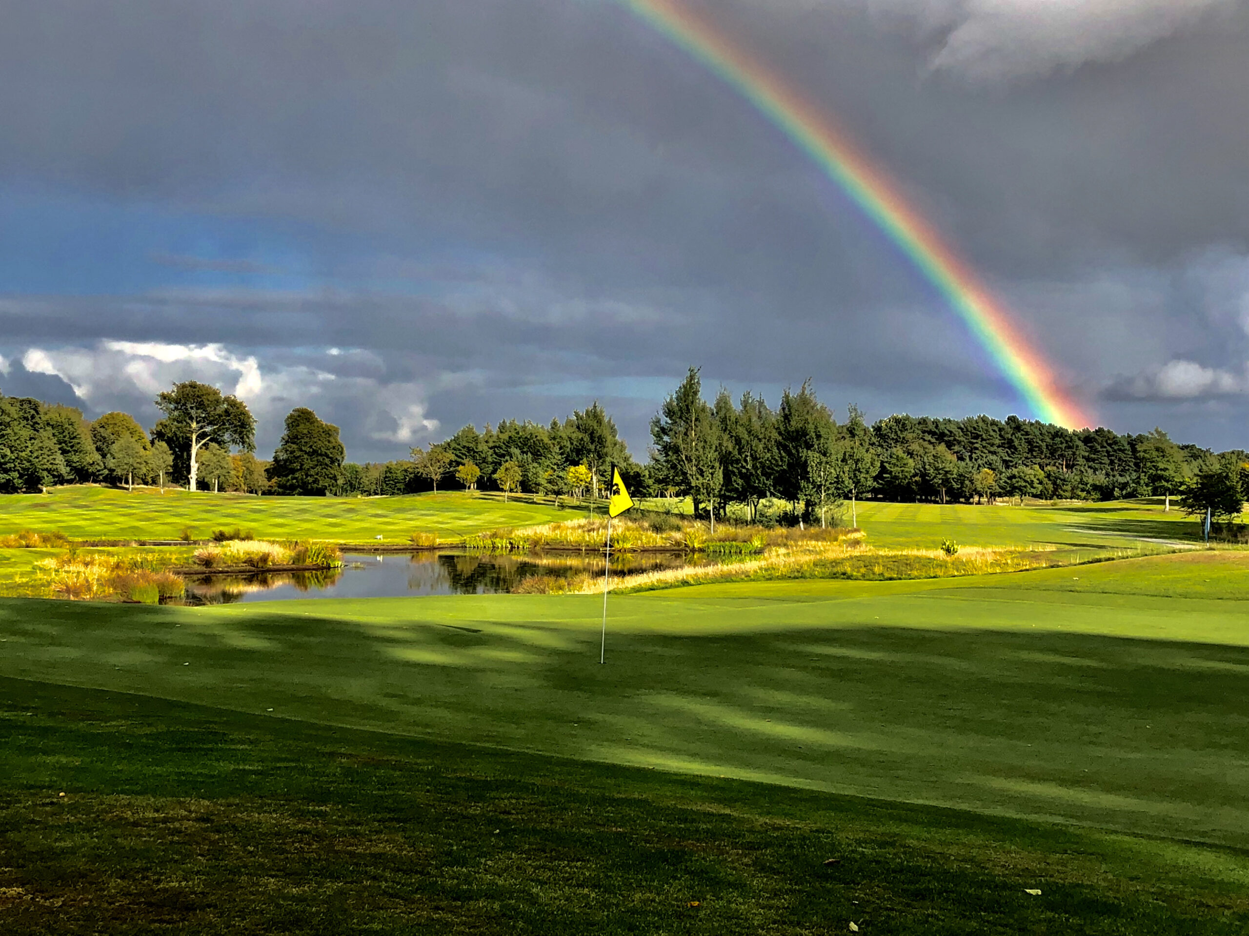 Hole with yellow flag at Meldrum House Golf Club, one of the best golf courses in Scotland