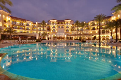 Exterior of ONA Mar Menor Golf & Spa with outdoor pool at night
