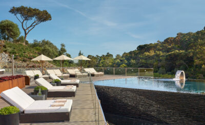 Sun loungers by outdoor pool at Penha Longa Resort