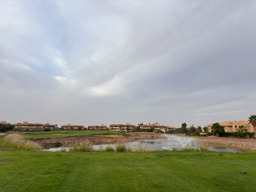 Fairway with water fountain inside lake at The Montgomerie Marrakech