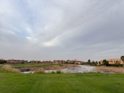 Fairway with water fountain inside lake at The Montgomerie Marrakech