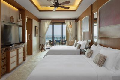 Double bed accommodation with two beds at The St Regis Saadiyat Island Resort with a balcony
