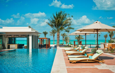 Outdoor pool with loungers at The St Regis Saadiyat Island Resort