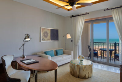 Accommodation living area with balcony at The St Regis Saadiyat Island Resort