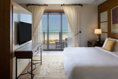 Double bed accommodation at The St Regis Saadiyat Island Resort with a balcony