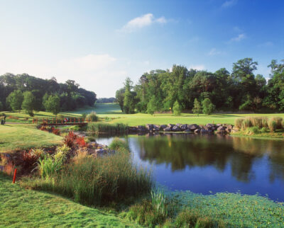 Lake on fairway at Fota Island - The Deerpark Course with trees in background