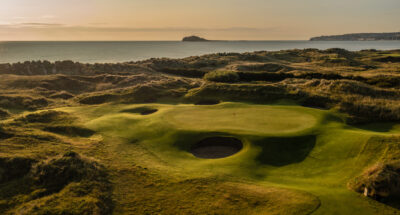 Hole with bunkers and mounds around at Jameson Golf Links with ocean view
