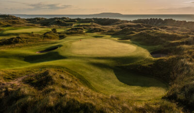 Hole with bunkers and mounds around at Jameson Golf Links