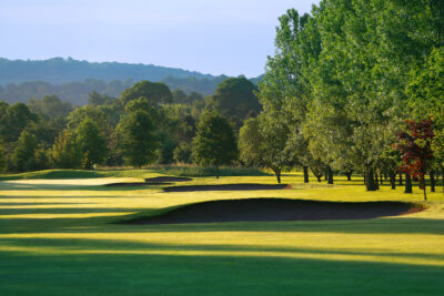 Bunkers on fairway with trees around at Belton Woods - Lakes Course