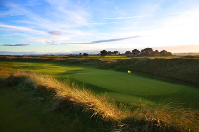 Hole with yellow flag at Portmarnock Golf Club