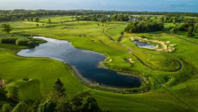 Aerial view of Killeen Castle Golf Club with lake on fairway