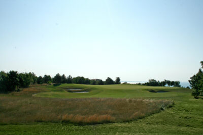 Bunkers on the fairway with trees around at Lighthouse Golf Course