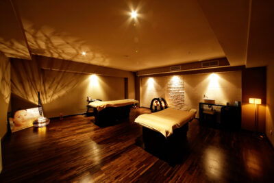 Spa at the Lighthouse Golf Resort with treament beds in a dimly lit room