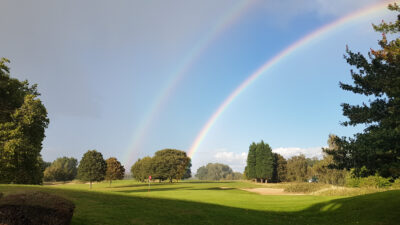 Double rainbow over course