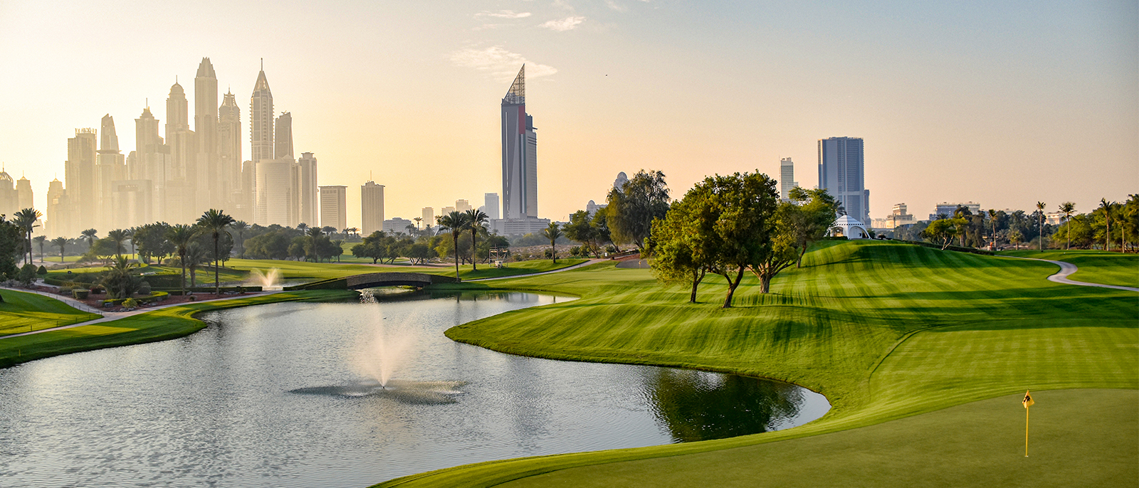 dubai golf course with building skyline in the back